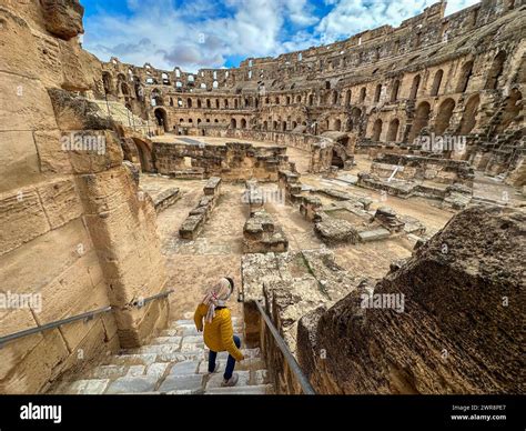 foreign tourist descends   interior   roman amphitheatre