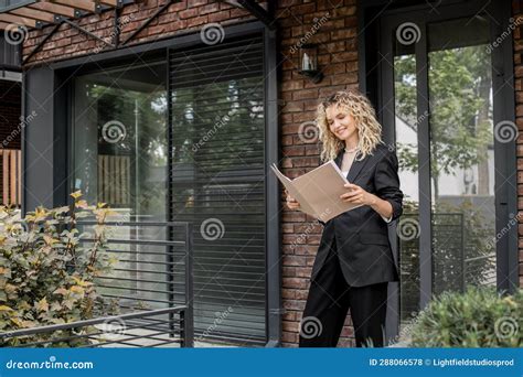 Smiling Blonde Real Estate Agent Looking Stock Photo Image Of Attractive Marketing