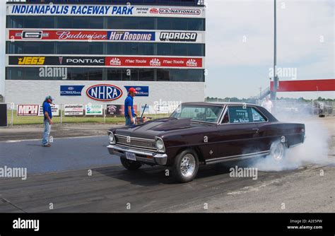 Chevrolet Nova drag race car does burnout before drag race start at ...