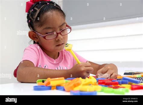 4 Year Old Brunette Latina Girl With Autism Spectrum Disorder ASD Like Asperger Rett And Heller