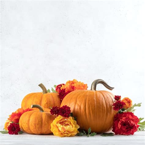 Premium Photo | Fall autumn decor from pumpkins flowers and leaves