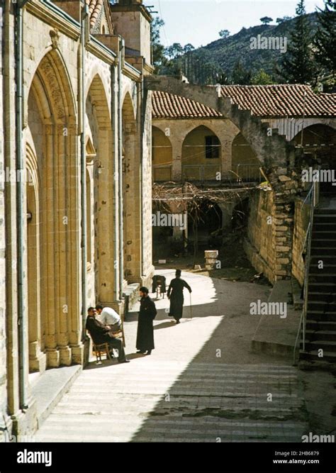 Monks And Other People Sitting Outside Church At Panagia Machairas