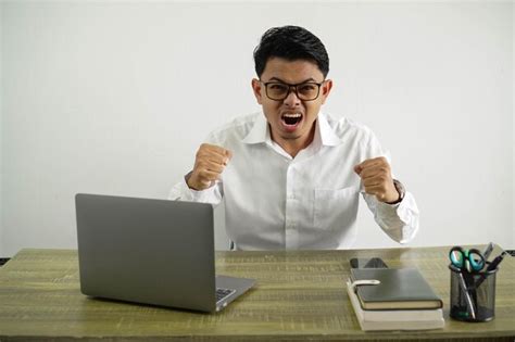 Premium Photo Young Asian Businessman In Workplace Frustrated By A