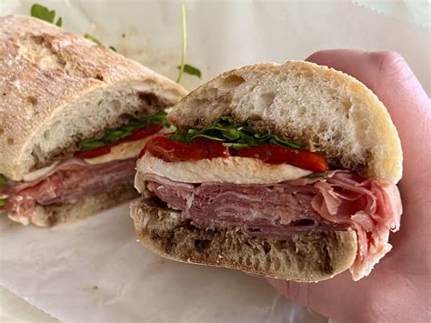 Prosciutto di Parma, fresh mozzarella, roasted peppers, and baby