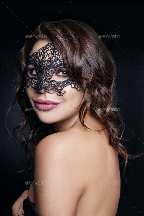 Mysterious Girl In A Black Mask Masquerade Sexy Nude Brunette Woman With Curly Hair On A Black