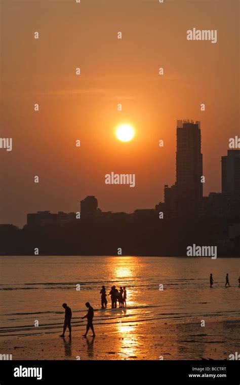 India Mumbai Bombay Chowpatty beach people on beach at sunset view ...