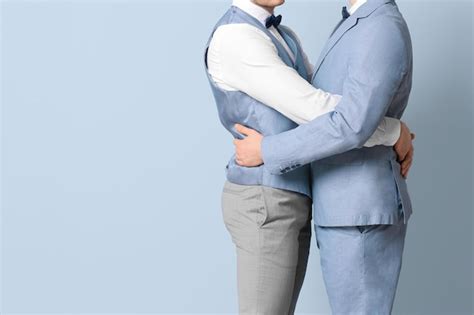Premium Photo Happy Gay Couple Embracing On Color Background