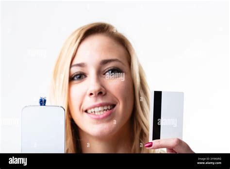 Happy Blonde Woman With Smartphone Credit Card For Quick Online Shopping Convenience In The