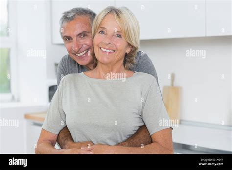Happy Mature Couple Hugging Stock Photo Alamy