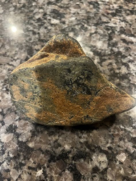 Strange rock in Delaware. My son found this rock. It weighs 726 grams