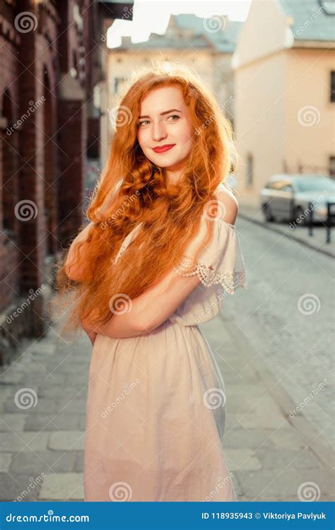 Smiling Ginger Model With Long Hair Wearing White Dress With Naked Shoulders Stock Image Image