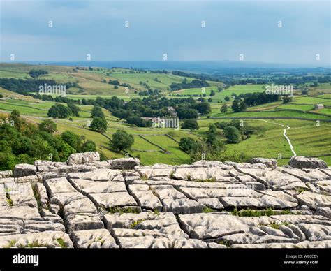 View Over Malhamdale From The Limestone Pavement Above Malham Cove Near