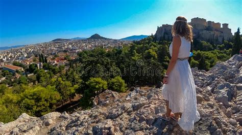 Athens Rear View Of Tourist Woman In White Dress Looking At Parthenon