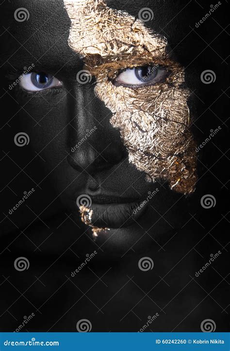 Fashion Portrait Of A Dark Skinned Girl With Gold Make Up Beauty Face