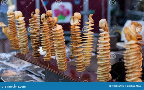 Fried Swirl Potato Spiral On A Stick During Street Food Festival Fast