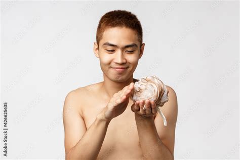 Beauty People And Hygiene Concept Portrait Of Funny Silly Asian Naked Man Brushing Sponge