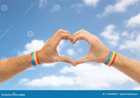 Male Hands With Gay Pride Wristbands Showing Heart Stock Photo Image