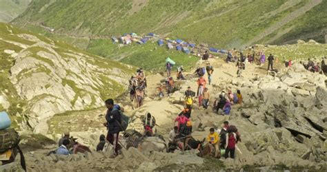 Devotees Of Lord Shiva Trekking To Manimahesh Lake To Offer The Annual