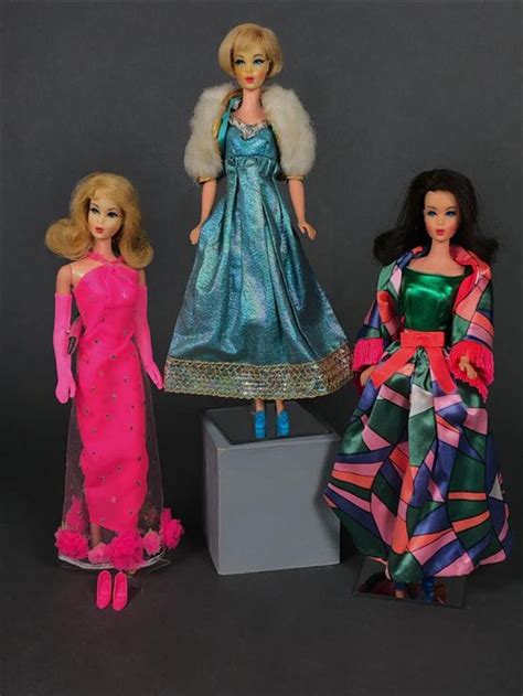 Lot VINTAGE BARBIES IN TAGGED FASHIONS BLONDE HAIR FAIR ON TWIST N TURN BODY WEARING