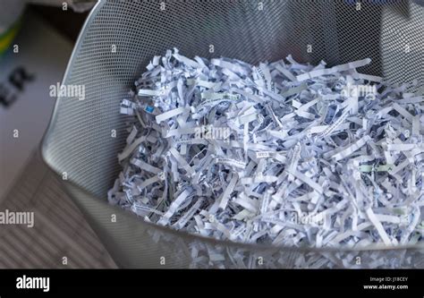 Shredded office paper in a basket Stock Photo - Alamy