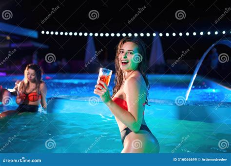 Pretty Woman In Bikini Drinking Cocktail And Hanging Out With Friends