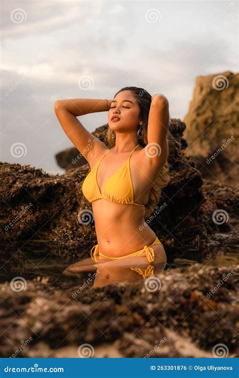 Asian Woman Posing On The Beach Beautiful Woman Wearing Yellow Bikini Slim Fit Body Tanned