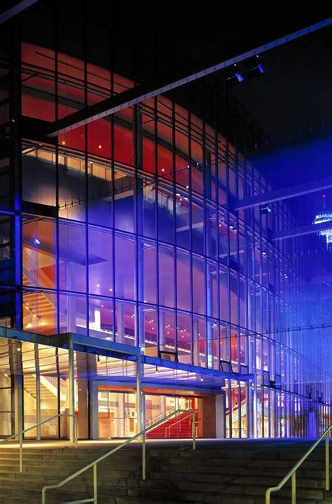 An Illuminated Building With Stairs Leading Up To It