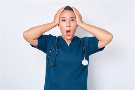 Premium Photo Shocked And Anxious Asian Woman Nurse Wearing Blue