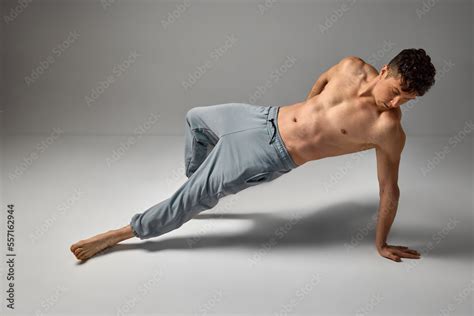Mature Man Posing Shirtless In Pants Over Grey Studio Background Fit Strong Muscular Body