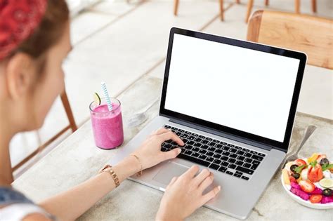 Free Photo Laptop With Blank White Screen On Table