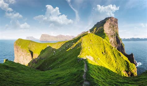 Kallur Lighthouse on Green Hills of Kalsoy Island Stock Image - Image ...