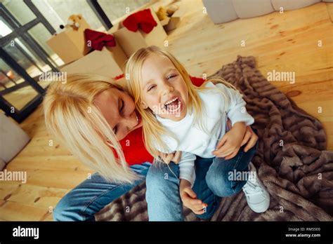 Cheerful Blonde Girl Laughing While Being Tickled Stock Photo Alamy