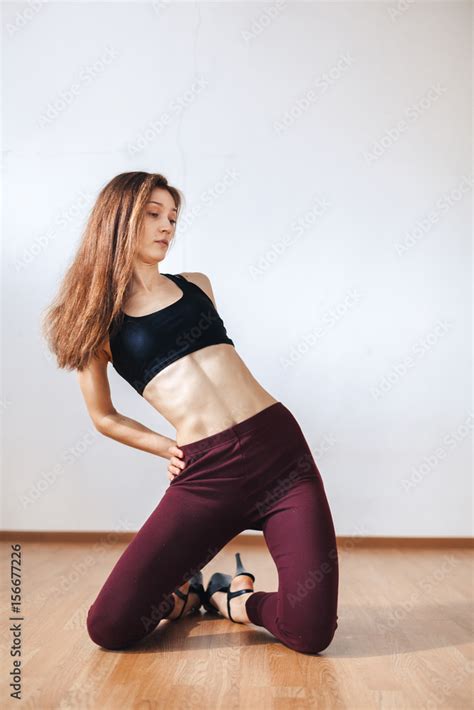Sexy Brunette Woman Dancing In High Heels In A Dancing Classroom Stock Photo Adobe Stock