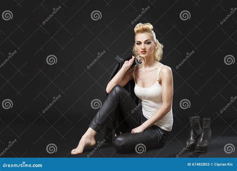 Blonde Rocker Girl Sitting Down Royalty Free Stock Photography CartoonDealer