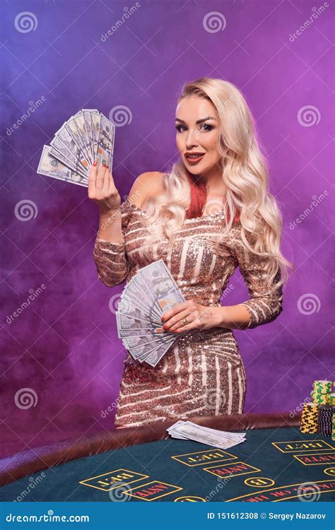 Blonde Woman With A Perfect Hairstyle And Bright Make Up Is Posing With Playing Cards In Her