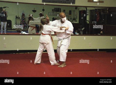 This action photo is of my daughter in her Karate class. Karate is a ...