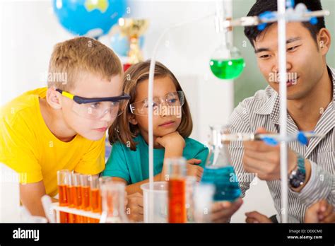 Primary Students In Science Class With Teacher Stock Photo Alamy