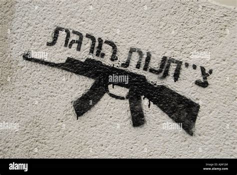 Anti war graffiti depicting an AK-47 Kalashnikov machine gun with a ...