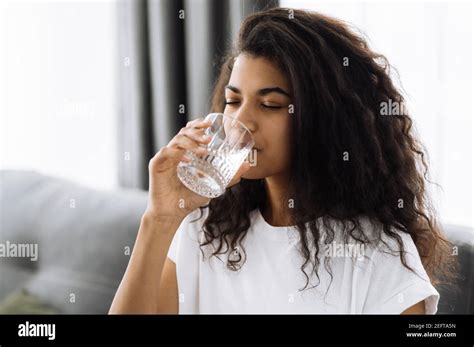 Healthy Lifestyle African American Young Woman Drinks A Glass Of Water