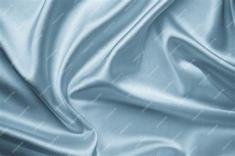 Гладкая элегантная серебряная шелковая ткань фона. металлический серый ...