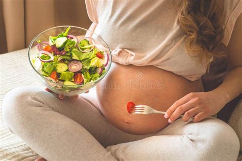 Pregnancy And Healthy Organic Nutrition Pregnant Woman Enjoying Fresh