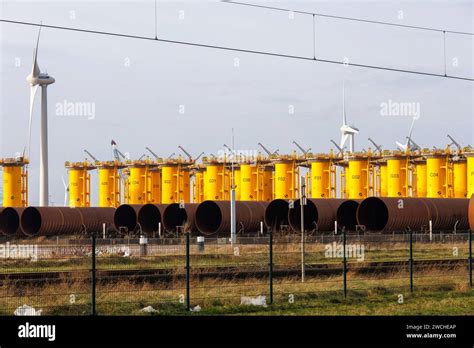 Foundations For Offshore Wind Turbines Are Stored In The Port Of