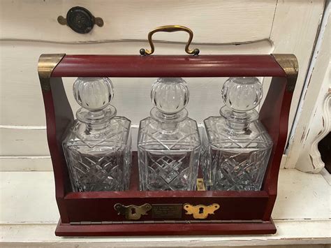 Lot 360 Edwardian Style Three Bottle Tantalus With