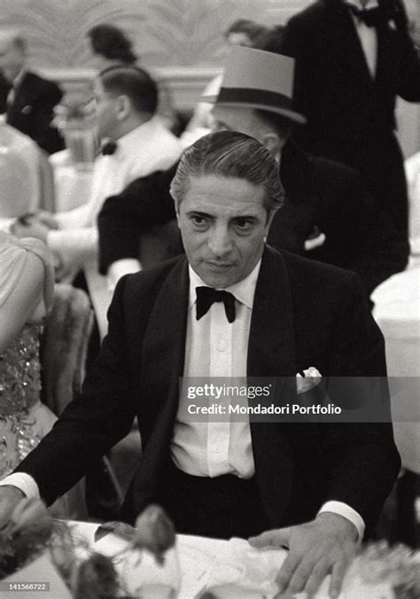 The Greek shipowner Aristotle Onassis photographed during a dinner in
