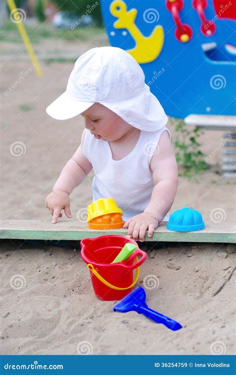 Baby Plays with Sand on Playground Stock Image - Image of playing ...