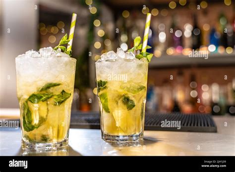 Mojito Cocktail On Bar Counter With Lemons Limes And Species With Copy