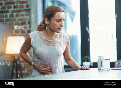 Upset Mature Woman Wanting Medication Stock Photo Alamy