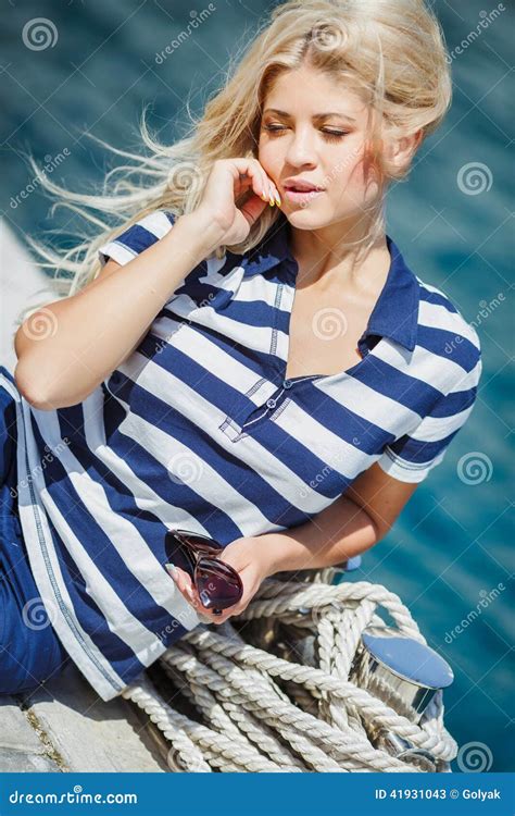 Adorable Blonde Sits Against A Backdrop Of Yachts Stock Image Image Of Dress Caucasian 41931043