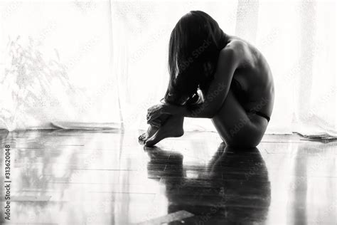 Sad Naked Woman Sit By Window Stock Photo Adobe Stock