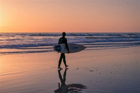 HD Wallpaper A Man Standing Triumphant On A Beach In New Romney While